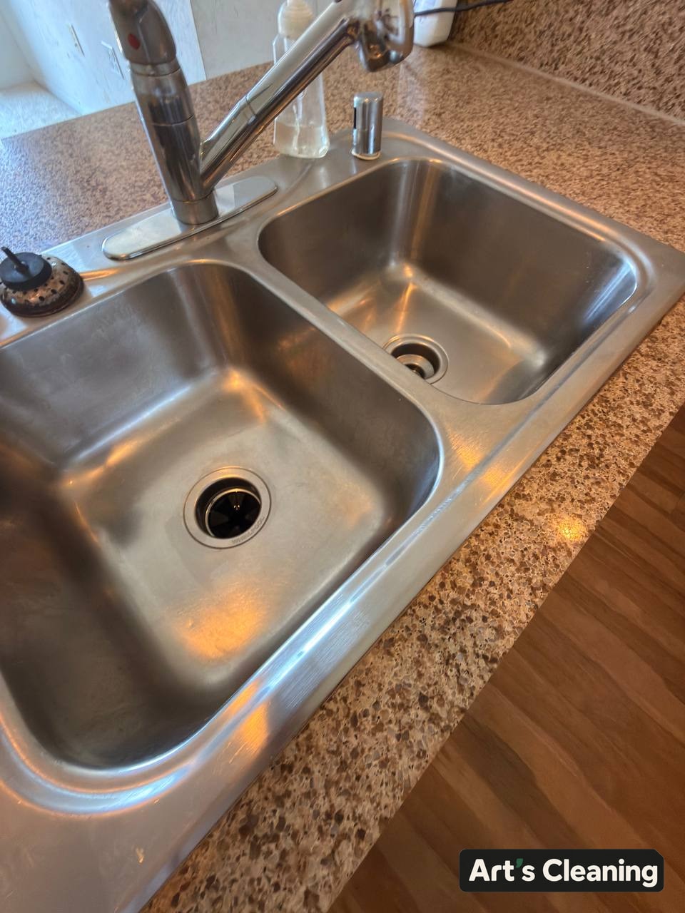 Polished kitchen sink detail after cleaning