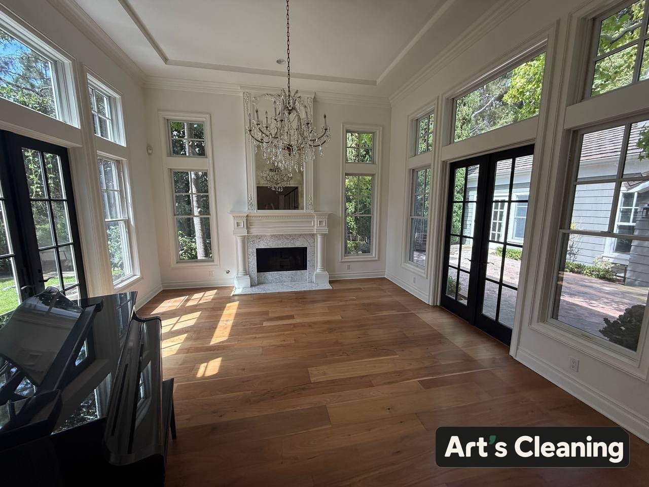 Clean empty living room with a bright sunroom