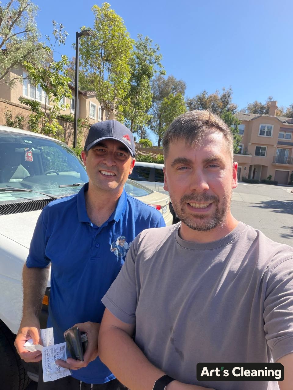 Art standing with specialty-cleaning technician Mike outdoors